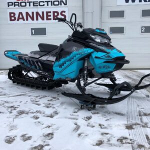 Expert automotive-graphics and signage specialist applying custom decals to a vehicle in Saskatoon.